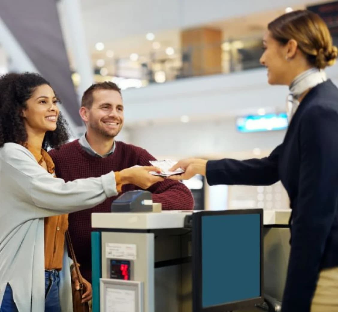 E-commerce support representative assisting customers at a service counter